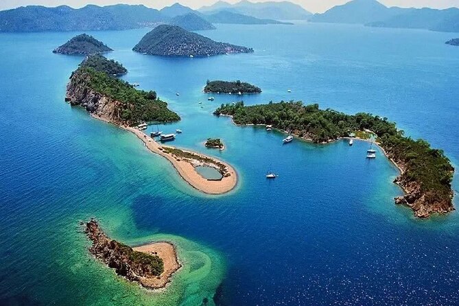 12 Islands Boat Tour from Fethiye with Grilled Lunch - Kızıl Island adds red cliffs and underwater caves