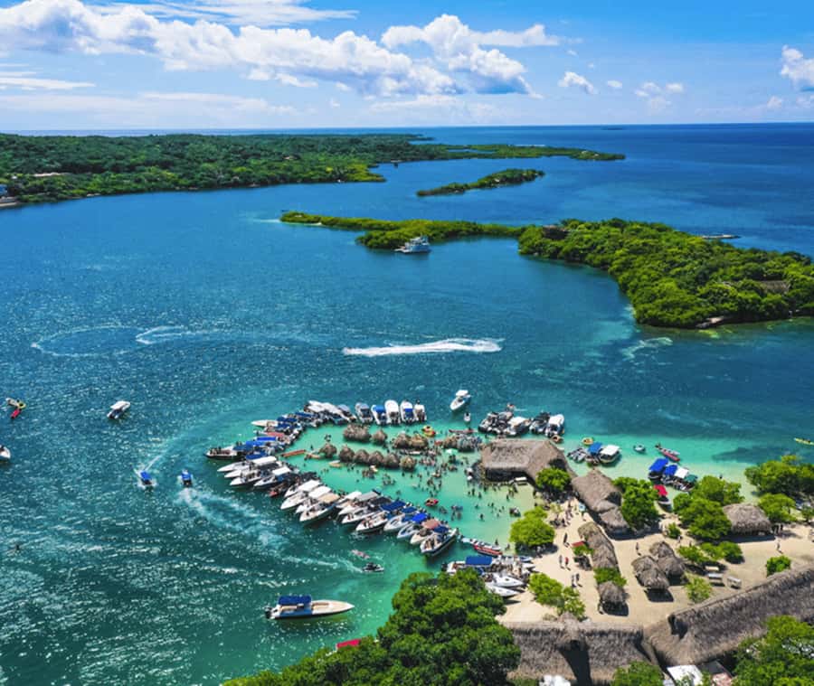 Cartagena: 4 Island Day Trip by Boat and Caribbean Lunch - Cholón, where the day gets loud