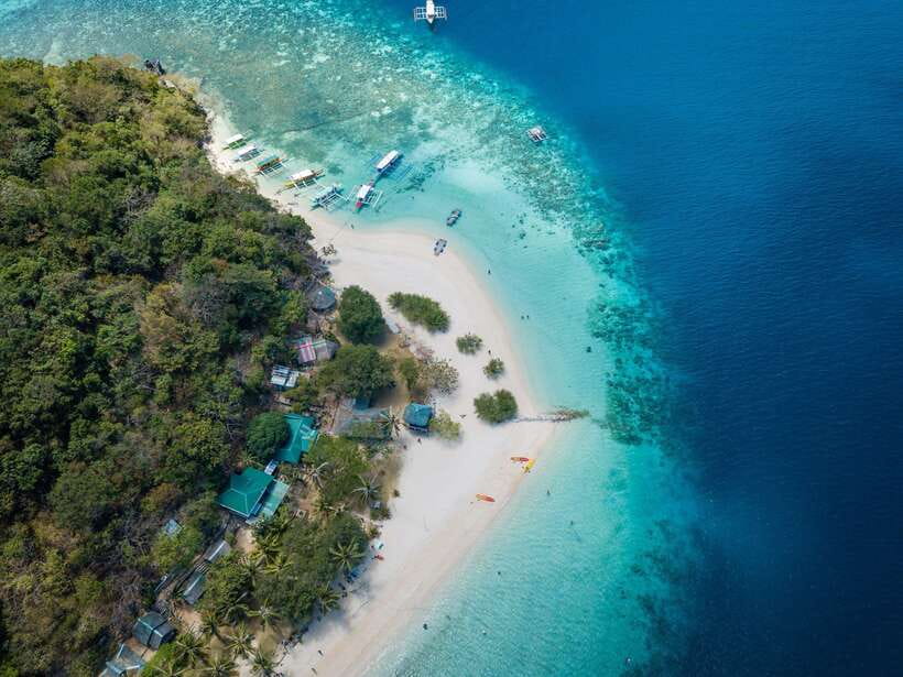 Coron: Coastal Cliffs, Beach & Malcapuya Island Hopping Tour - Banana Island brings the easygoing beach stop
