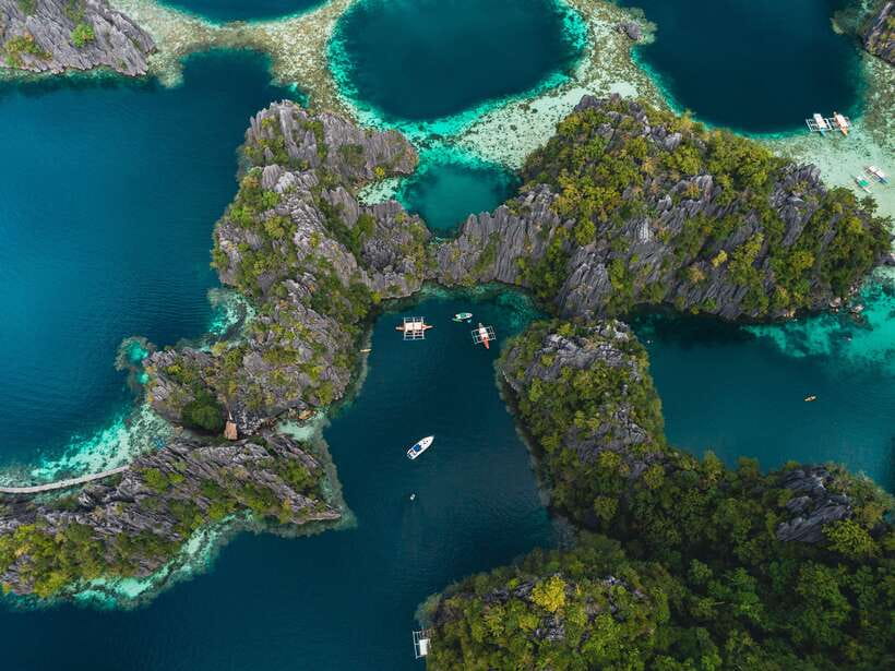 Coron: Private Island-Hopping Tour on a Yacht or Speedboat - Barracuda Lake, limestone, and a different kind of swim