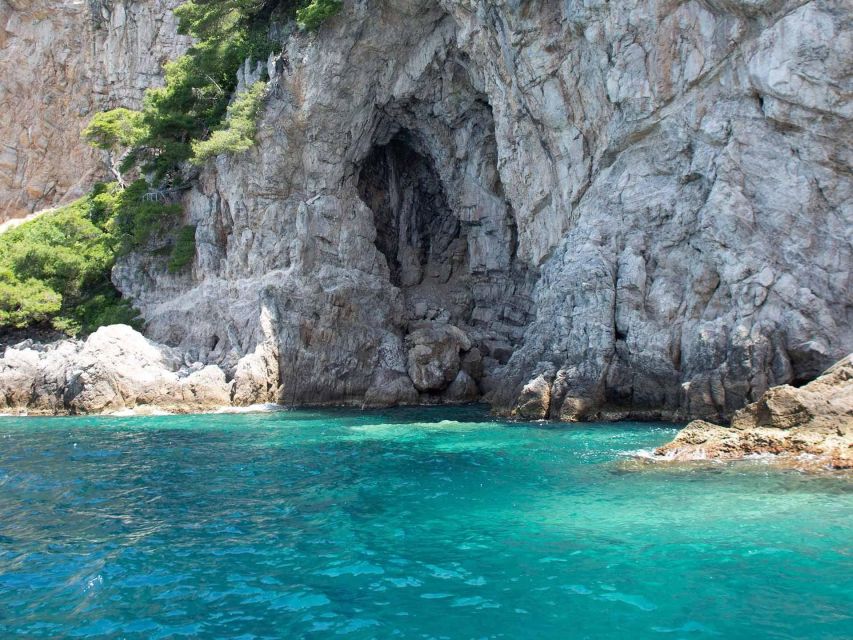 Elaphite Islands Cruise and Blue Cave Snorkeling Boat Tour - Blue Cave on Koločep: scenic stop, mixed expectations