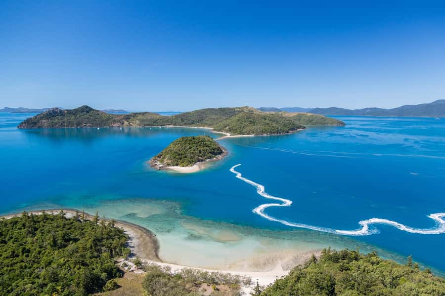 From Airlie Beach: Two-Island Safari - Crossing toward South Molle Island