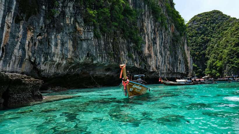 From Phi Phi: Full Day 7 Island Tour by Longtail with Sunset - Monkey Beach and Viking Cave: quick looks at Phi Phi’s coast
