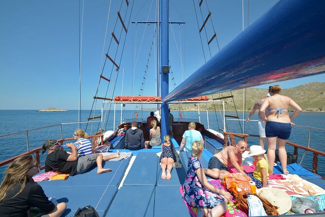 Full Day 3-Island Boat Cruise from Port of Kos - Seating, shade, music, and the practical side