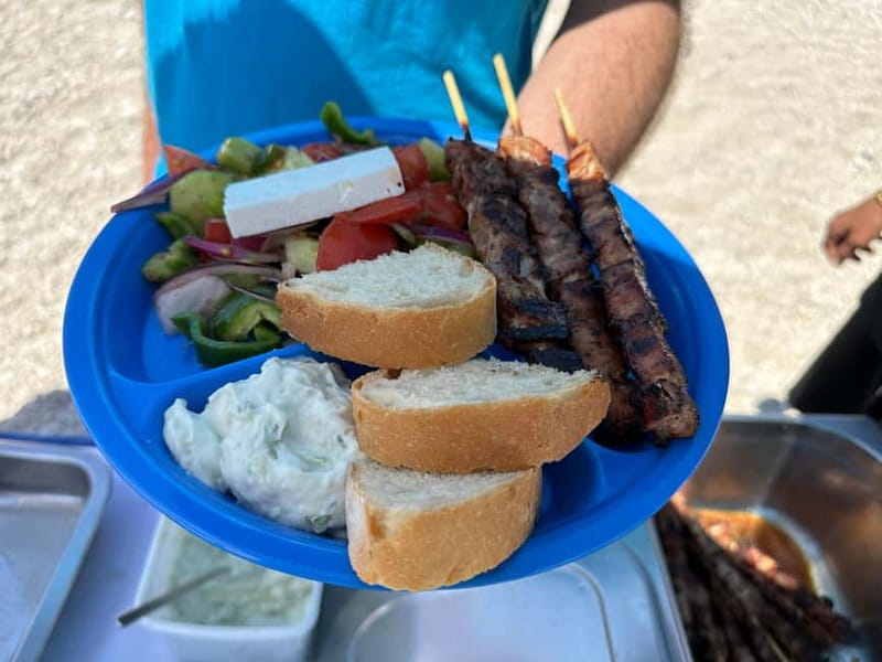 Nydri: Island Hopping Boat Cruise with Beach BBQ Lunch - Swimming inside Papanikolis Cave