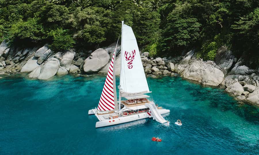Phuket: Sailing Yacht Island Hopping & Party Full-Day Cruise - Two hours at Banana Beach on Coral Island
