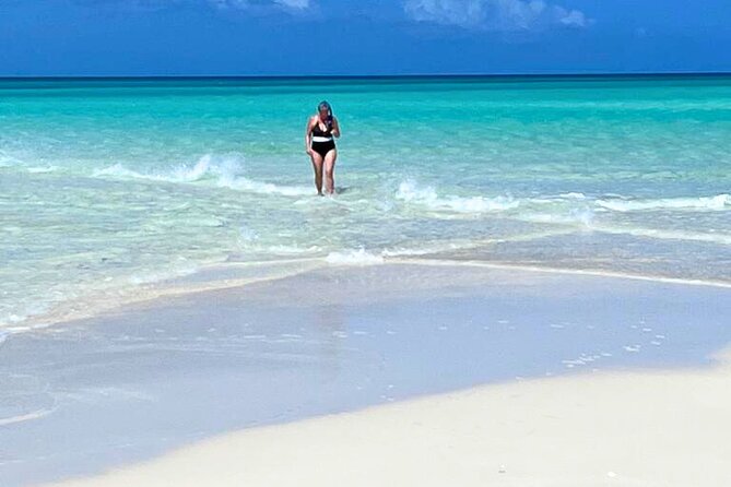 Private Boat Tour with Snorkeling, Island Hopping, and Noahs Ark - Grace Bay Beach for snorkeling and sand dollars