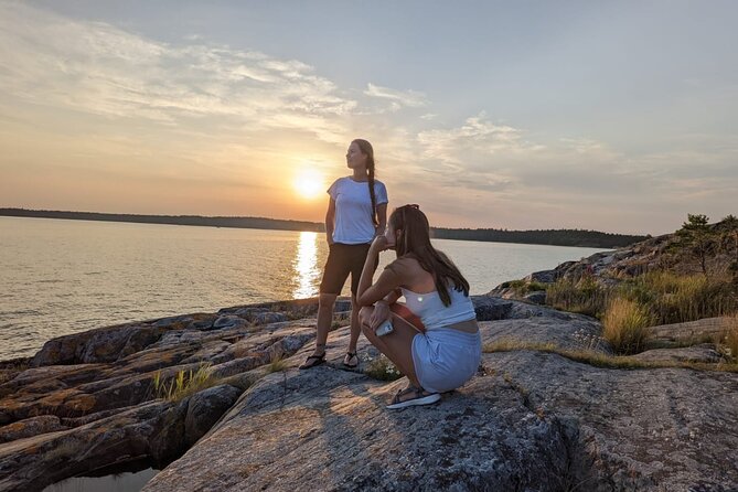 PRIVATE Sunset Kayaking in Stockholm Archipelago Nature Reserve - An island stop for Swedish fika