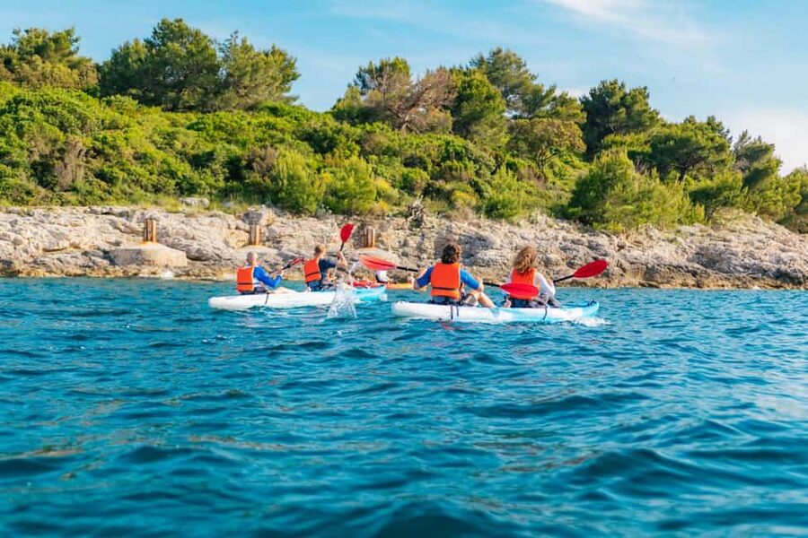 Pula: Three Island Kayak Tour with Cave Photo & Snorkeling - The first paddle toward Fratarski island