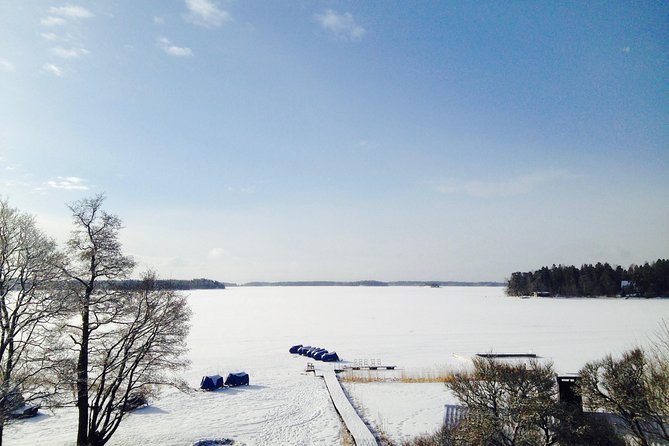 Snowmobile Safari in Helsinki Archipelago with Lunch - Ice fishing and kick sleds add local character