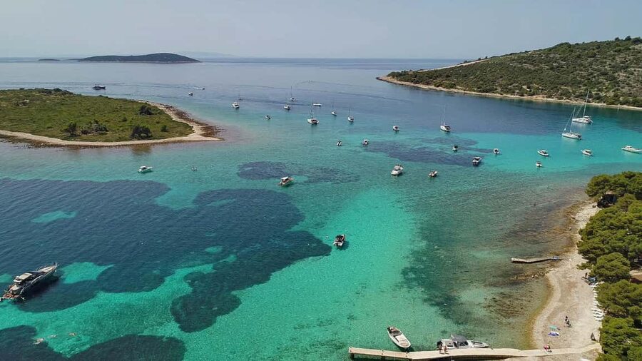 Trogir: Blue Lagoon and 3 Islands Speedboat Tour - Blue Lagoon: beautiful water, busy shoreline